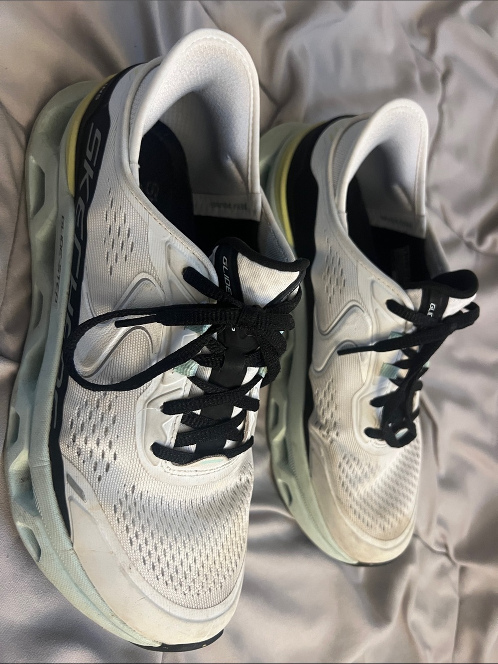 Skechers Women’s White Athletic Sneakers with Black Laces and Yellow Heel